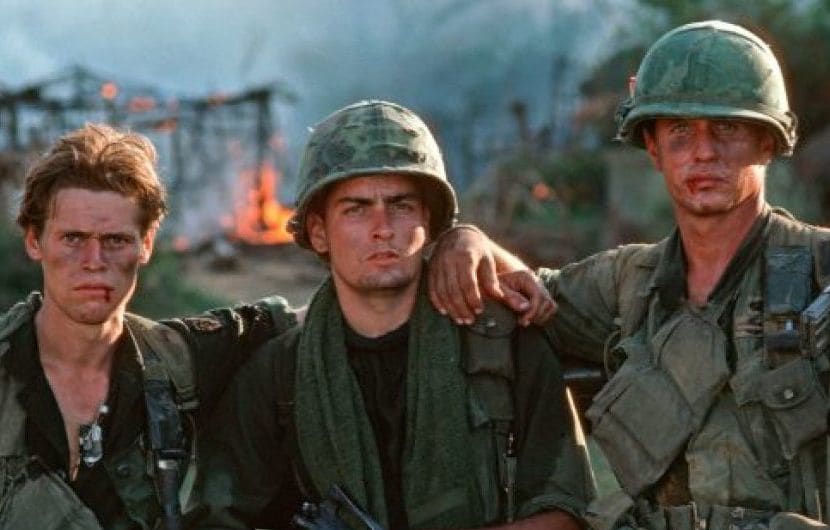 Actors Willhem Dafoe, Charlie Sheen and Tom Berenger during the filming of Oliver Stone's 1986 film Platoon