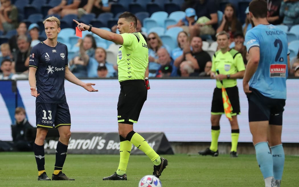 Nicholas Pennington of the Phoenix receives a red card
