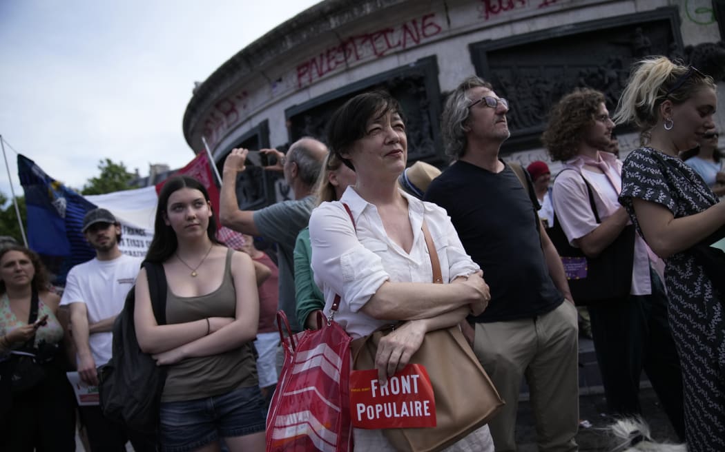 People gather on Paris' Republique Plaza during a political rally on 27 June, 2024. Anti-racism groups joined French unions and left-wing coalition in protests against the surging nationalist far right.