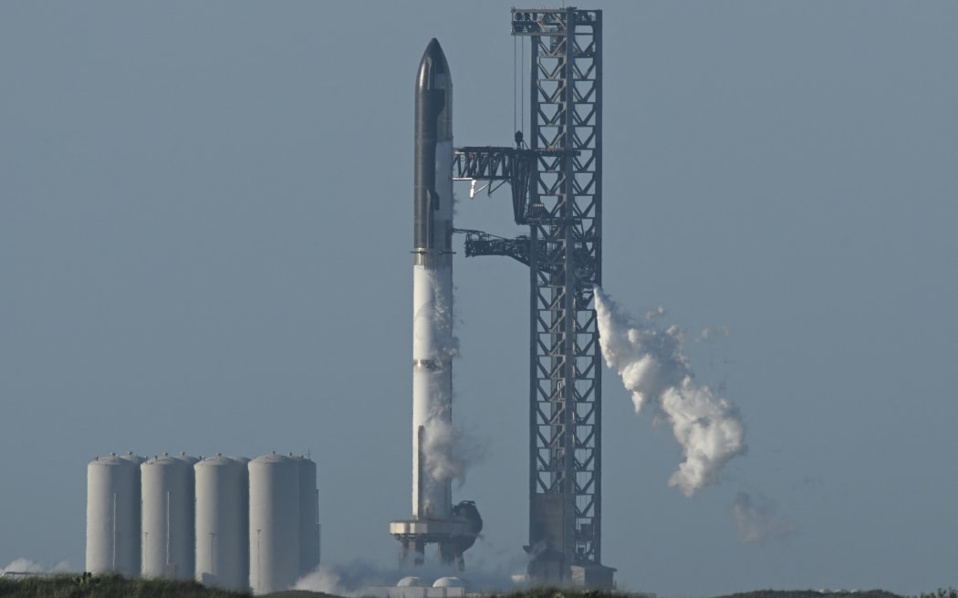The SpaceX Starship rocket stands on the launchpad from the SpaceX Starbase in Boca Chica as seen from South Padre Island, Texas on 17 April, 2023.