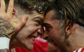 Ryan Yates, left, and Jota Silva celebrate Nottingham Forest's victory in their FA Cup quarterfinal against Brighton and Hove Albion, 30 March, 2025.
