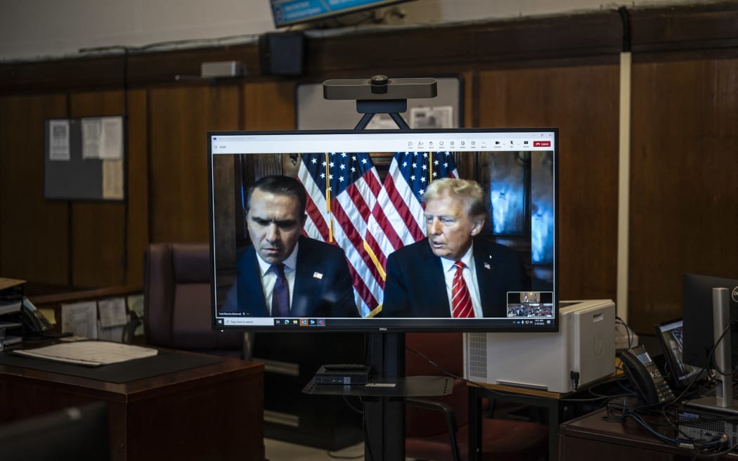 NEW YORK, NEW YORK - JANUARY 10: U.S. President-elect Donald Trump appears remotely for a sentencing hearing with his attorney Todd Blanche (L) at Manhattan Criminal Court on January 10, 2025 in New York City. The U.S. Supreme Court rejected President-elect Donald Trump’s last-minute bid to halt his sentencing in the criminal hush-money case. Trump was found guilty on all 34 felony counts of falsifying business records, becoming the first former U.S. president to be convicted of felony crimes.   Jabin Botsford - Pool/Getty Images/AFP (Photo by POOL / GETTY IMAGES NORTH AMERICA / Getty Images via AFP)