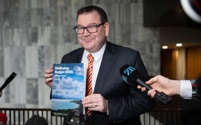 Finance Minister Grant Robertson with the Wellbeing Budget 2022