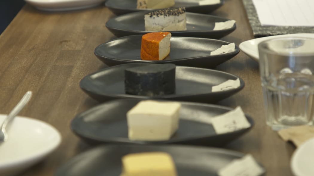 A line-up of vegan cheeses at the first vegan cheese competition.
