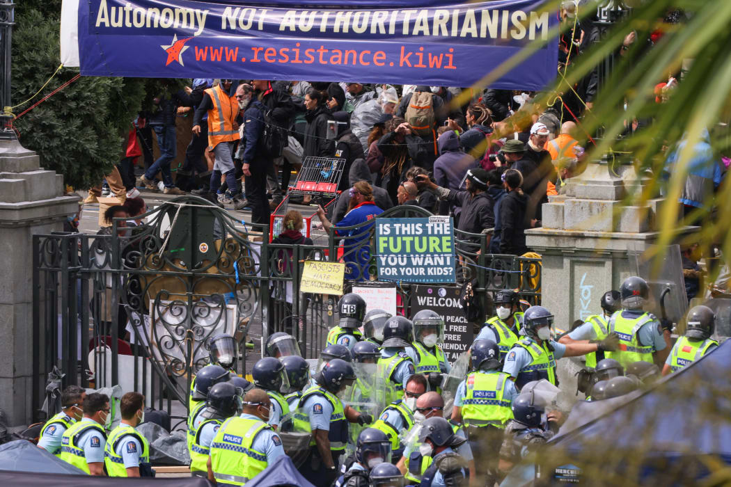 Police in Parliament's grounds assemble at the northern Molesworth gate and wait for the Police on Molesworth street to meet their position.
