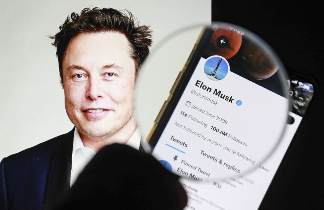 ISTANBUL, TURKIYE - JULY 9: In this photo illustration Tesla and SpaceX CEO Elon Musk's twitter profile is displayed on a mobile phone screen and the image of Elon Musk is displayed on a computer screen in Istanbul, Turkiye on July 9, 2022. Tesla CEO Elon Musk announced Friday that he is pulling out of his $44 billion deal to buy Twitter. Celal Gunes / Anadolu Agency (Photo by Celal Gunes / ANADOLU AGENCY / Anadolu Agency via AFP)