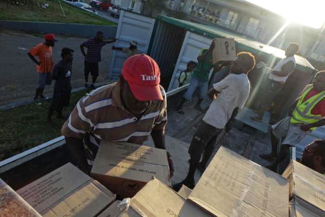 Volunteers in Vanuatu store donated goods after Cyclone Pam.
