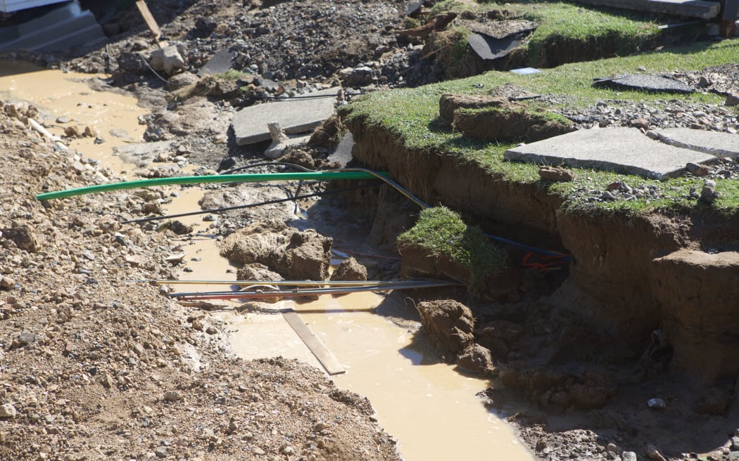 Floodwaters tore out huge chunks of the ground around the Edgecumbe homes.