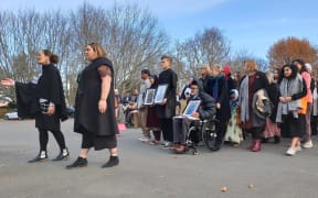 The family of victims of the Christchurch mosque attacks including Farid Ahmed, who is in a wheelchair.