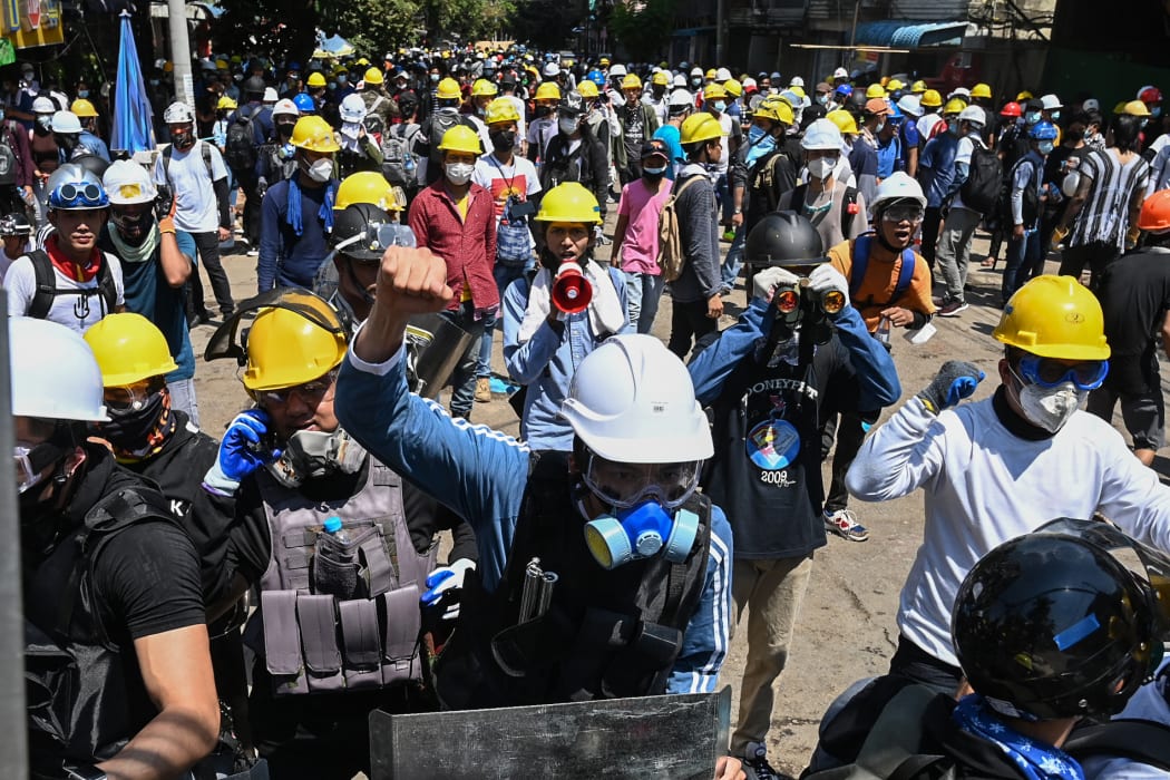 Protesters wearing protective gear take part in a demonstration against the military coup in Yangon over the weekend.