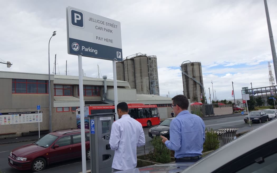 Parkers use one of the new pay-by-plate parking machines that have appeared at some Auckland car parks.