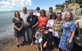 Pōuto community members at Fisherman's Point where the wharf will soon stand.