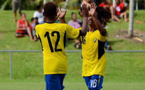 Solomon Islanders Gershom Totori and Richard Raromo celebrate a goal at the Oceania U17 Championship.