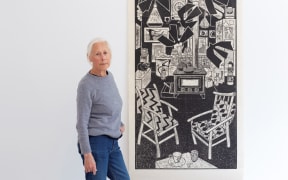 Robin White with her work ‘A meeting in the cosmos’ 2024 woodblock print on washi