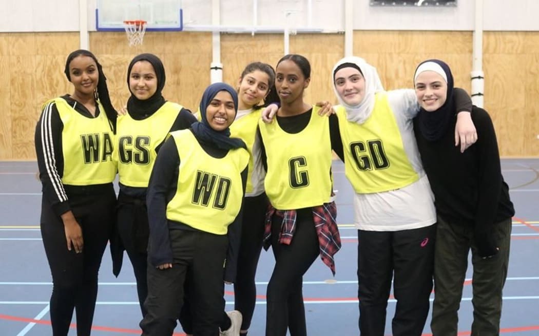 A group of women gather for a photo at the CRF netball tournament in 2019.