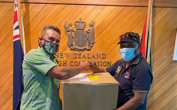 New Zealand's High Commissioner in Papua New Guinea, Phillip Taula, hands over media equipment to local state broadcaster NBC, 23 February 2021.