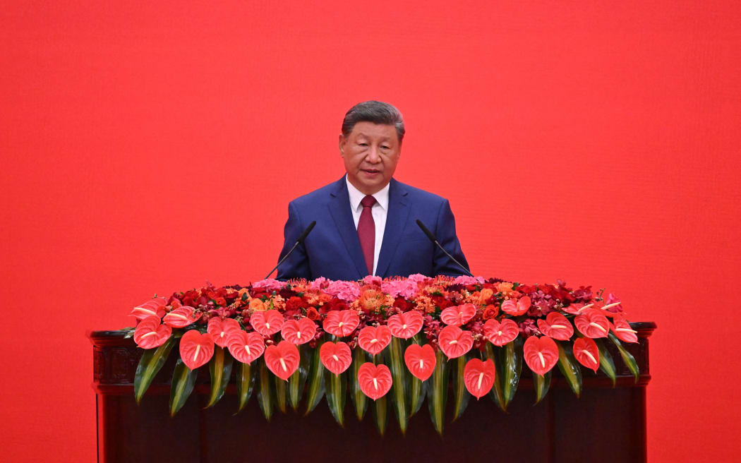 China’s President Xi Jinping delivers a speech at a reception in the Great Hall of People, following a military parade marking the 80th anniversary of victory over Japan and the end of World War II, in Beijing on September 3, 2025. (Photo by Jade Gao / AFP)