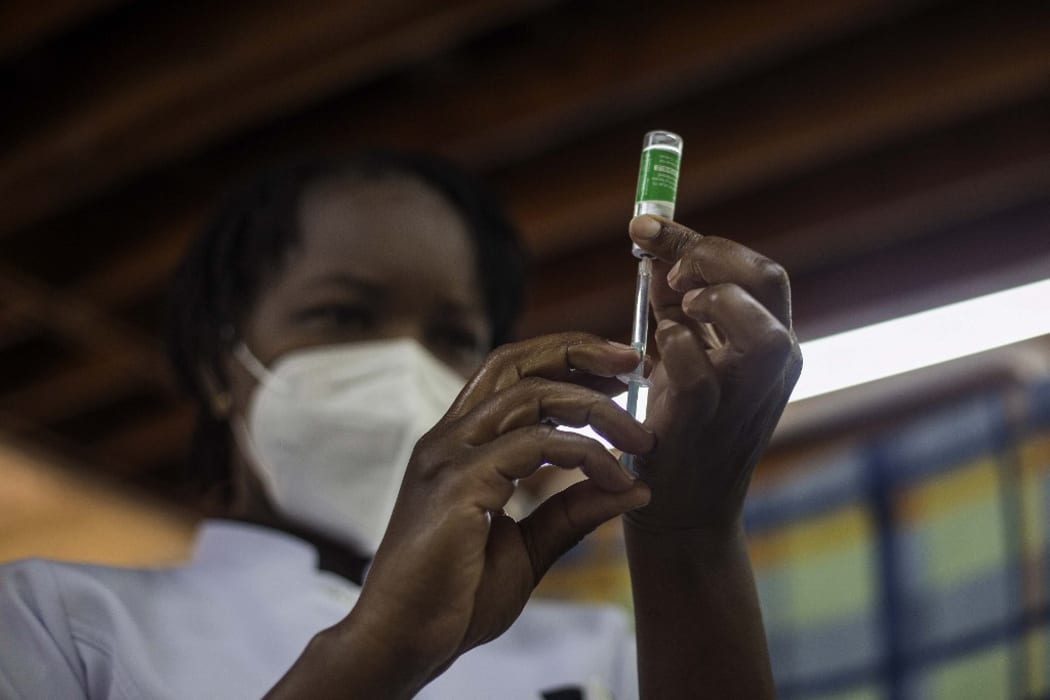 A nurse at Kenyatta National Hospital fills a syringe from a vial of the Covid-19 Covishield vaccine, the Indian version of the Oxford-AstraZeneca vaccine produced by the Serum Institute of India, the world's largest vaccine manufacturer by volume.
