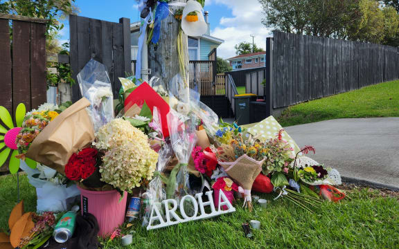 Flowers at the Beach Haven site where Joshuah Tasi died.