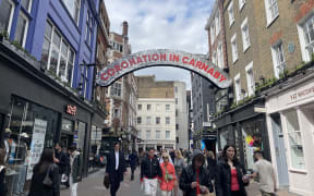 A sign reading Coronation in Carnaby above London's Carnaby Street. 3 May 2023.