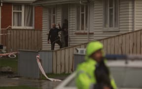 A property on George St is cordoned off by police after a shooting