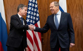 US Secretary of State Antony Blinken (left) and Russian Foreign Minister Sergey Lavrov shake hands before their meeting on 21 January, 2022, in Geneva, Switzerland.