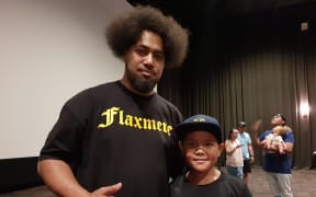 Peleti Oli, with his son Jesiah Oli, hopes to inspire others after his inclusion in the Flaxmere Heroes Calendar.