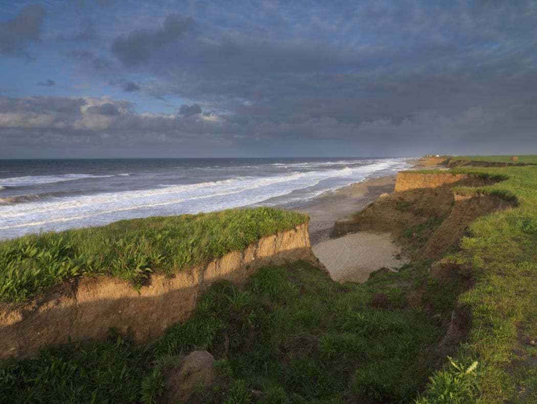 The heavily eroded cliffs at Happisburgh, Norfolk, England, United Kingdom, Europe (Photo by Jon Gibbs / Robert Harding Premium / robertharding via AFP)