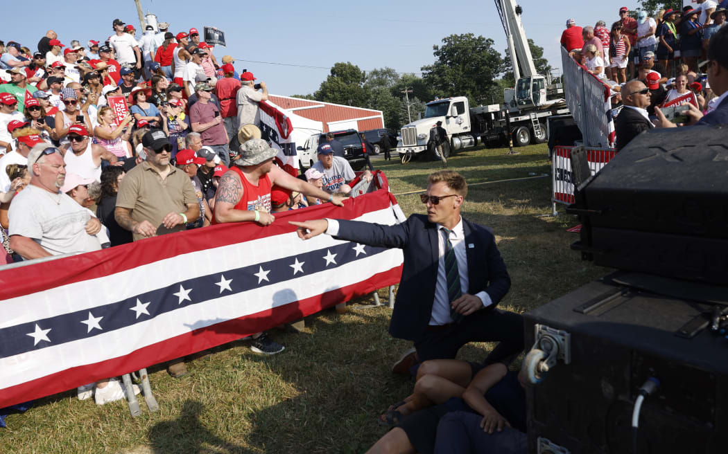 A Secret Service member reacting, in front of the crowd at the Butler, Pennsylvania rally, on 13 July, 2024.