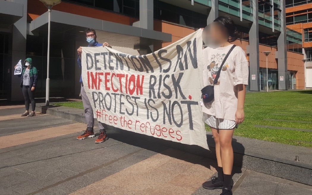 Protesters in Sydney outside the Department of Home Affairs.