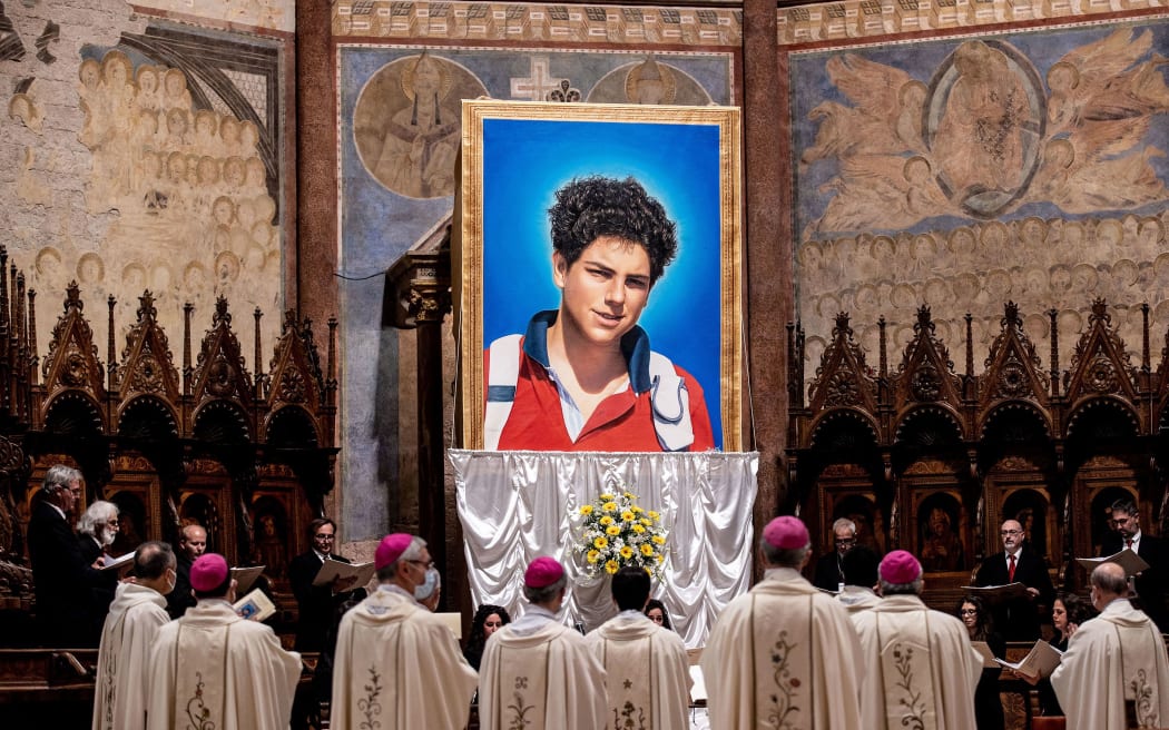 A tapestry of Carlo Acutis is unveiled at St. Francis Basilica during the beatification ceremony of Acutis on October 10, 2020, in Assisi, Italy.