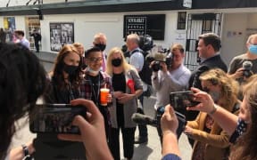 Labour leader Jacinda Ardern takes a photo with a member of the public in Newmarket, Auckland during the 2020 campaign trail.