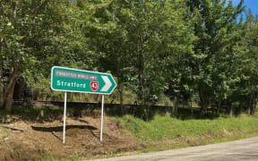 Signpost to Stratford along the Forgotten World Highway, New Zealand