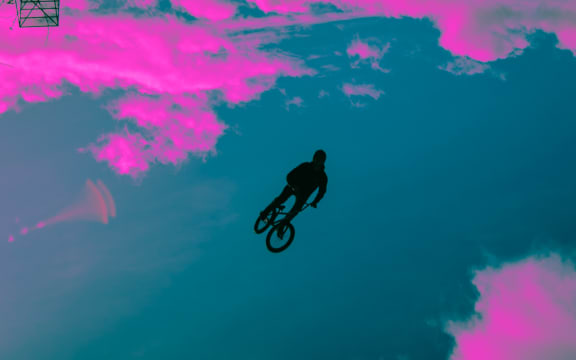 Tyrell jumps in the air on his bike