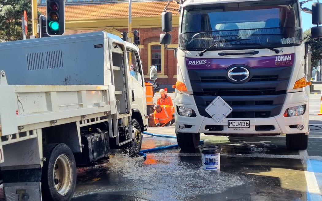 Workers carry out repairs at the corner of Johnson Street and Customhouse Quay after a burst pipe affected supply to at least 100 buildings.