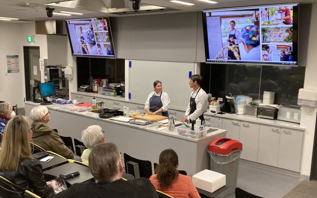The audience in AUT's School of Hospitality kitchen theatre watch on as Tracy Berno and Gaby Levionnois discuss sustainable eating and the world of the Pacific Food Lab.