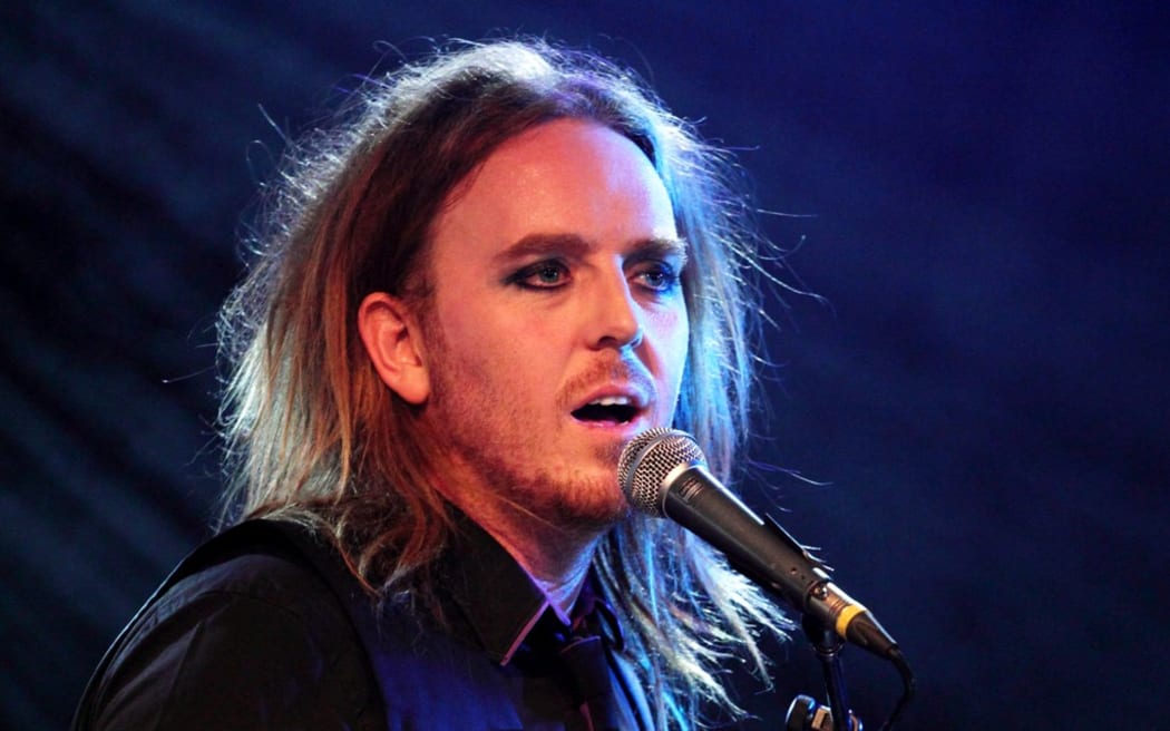Comedian Tim Minchin with microphone