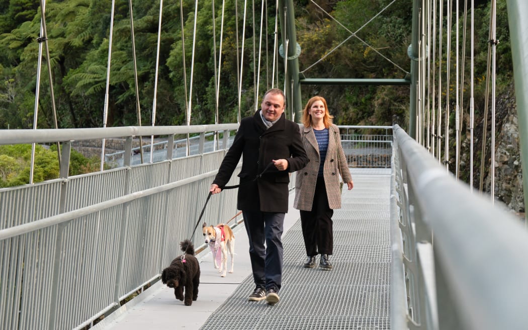 Cr Ros Connelly and her dog Cuba, and Wellington Water chair Nick Leggett with his dog Teddy