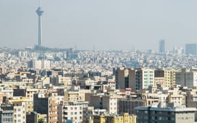 The skyline of Iran's capital city Tehran, with the Milad Tower at the top left.
