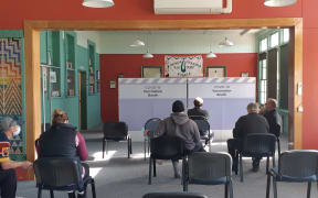 Members of the public line up for vaccines in the small Southland town of Colac Bay.