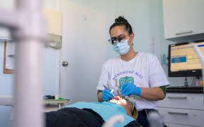 Stevie-Nyx Ruki works on a patient at Cliff Dental in Castlecliff, Whanganui.