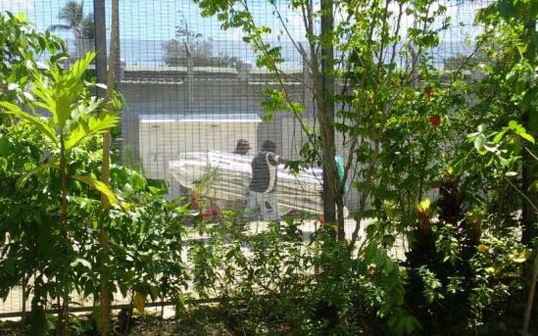 Locals helping themselves to a tent at the Manus Island detention centre 31/10/17.