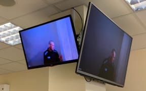 Alexei Navalny appears via a video link from prison before a court hearing to consider an appeal against his defamation verdict, at Moscow's Babushkinsky district court on April 29, 2021.