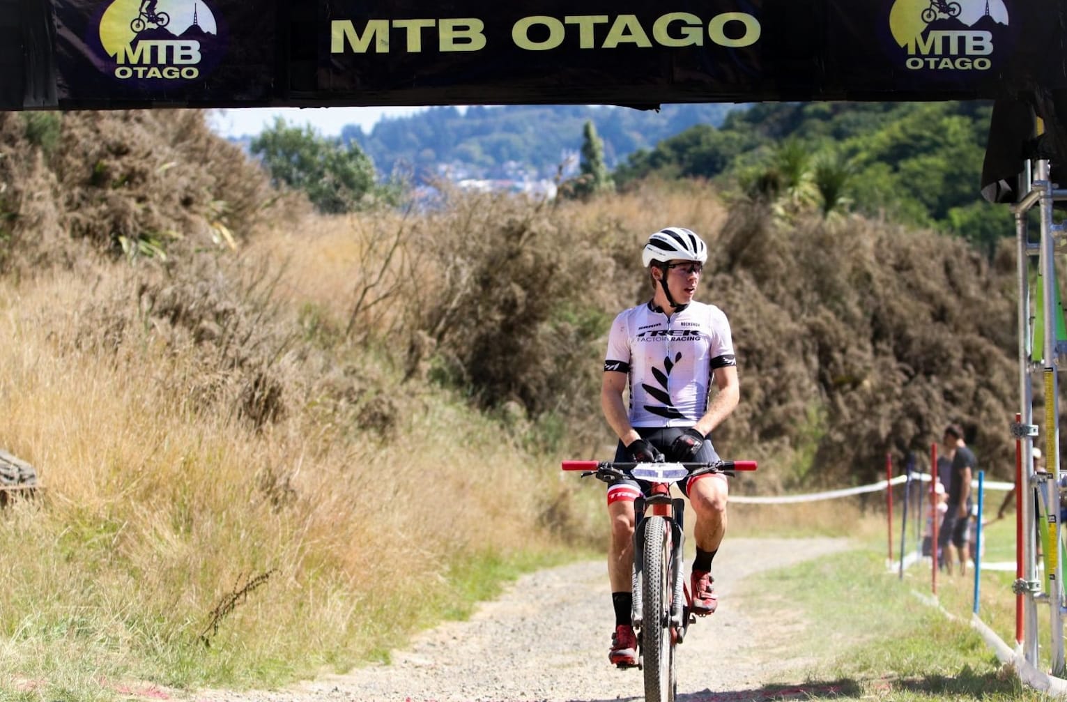 Anton Cooper successfully defended his cross-country honours at the UCI Altherm Oceania Mountain Bike Championships in Dunedin.