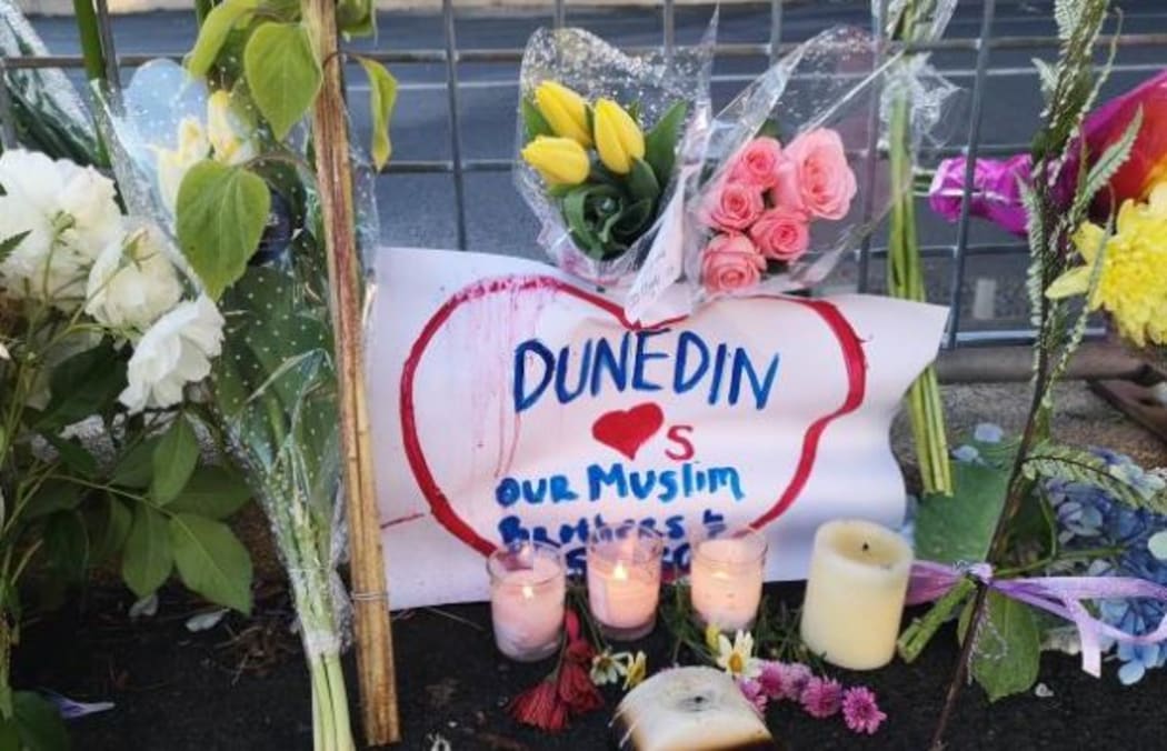 Flowers and candles were left outside Dunedin's Al Huda mosque this morning.