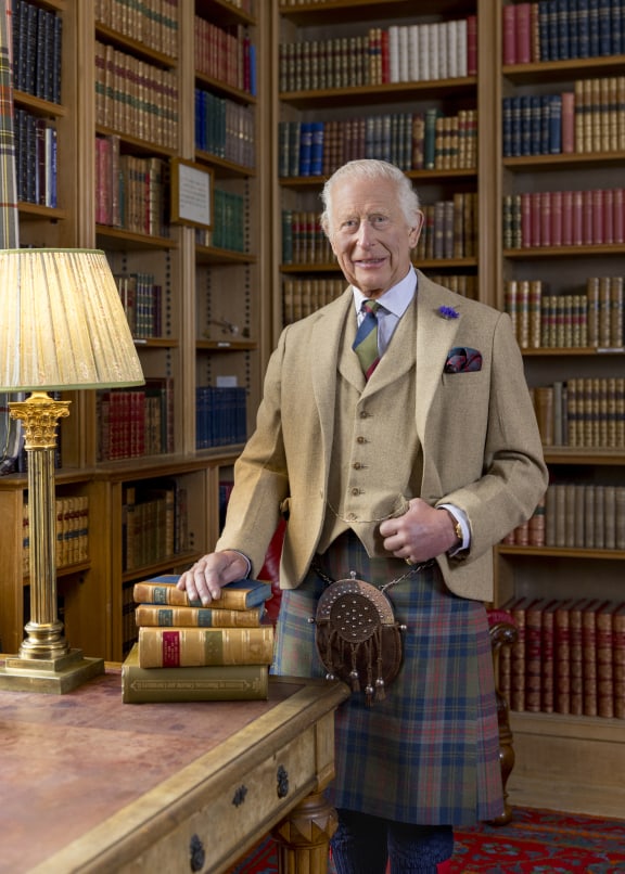 This handout photograph released by Buckingham Palace on January 25, 2025, shows Britain's King Charles III, posing for a photograph in the library at Balmoral, Scotland in Autumn 2024. The King is wearing a kilt made from The King Charles III tartan in a photograph released to mark Burns Night. (Photo by Millie Pilkington / BUCKINGHAM PALACE / AFP) / NO USE AFTER FEBRUARY 8, 2025 12:40:30 GMT - NO USE AFTER FEBRUARY 8, 2025 12:40:30 GMT - XGTY / RESTRICTED TO EDITORIAL USE - MANDATORY CREDIT "AFP PHOTO / MILLIE PILKINGTON / BUCKINGHAM PALACE " - NO SALES - NO MARKETING - NO ADVERTISING CAMPAIGNS - NO DIGITAL ALTERATION ALLOWED  - DISTRIBUTED AS A SERVICE TO CLIENTS - TO BE USED TO ILLUSTRATE THE EVENT MENTIONED IN THE CAPTION - NOT TO BE USED AFTER FEBRUARY 8, 2025 /