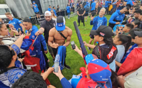 Toa Samoa fans surround their sporting heroes