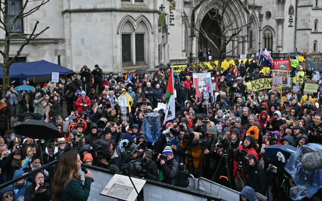 Stella Assange, wife of WikiLeaks founder Julian Assange (bottom left), addresses supporters and the media outside the Royal Courts of Justice, the UK's high court, in central London on February 21, 2024.