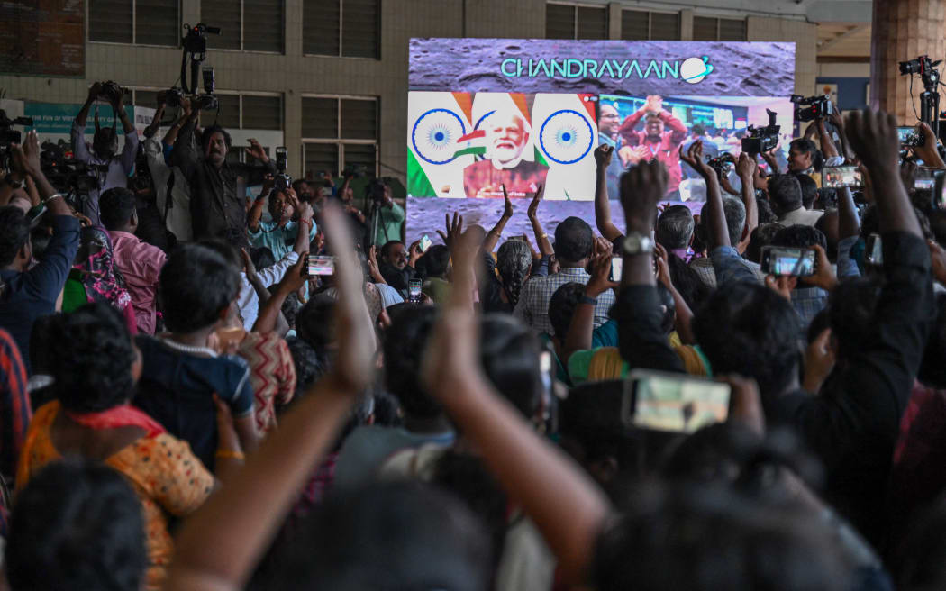 People in Chennai celebrate the successful lunar landing of Chandrayaan-3 spacecraft on the south pole of the moon, 23 August 2023.