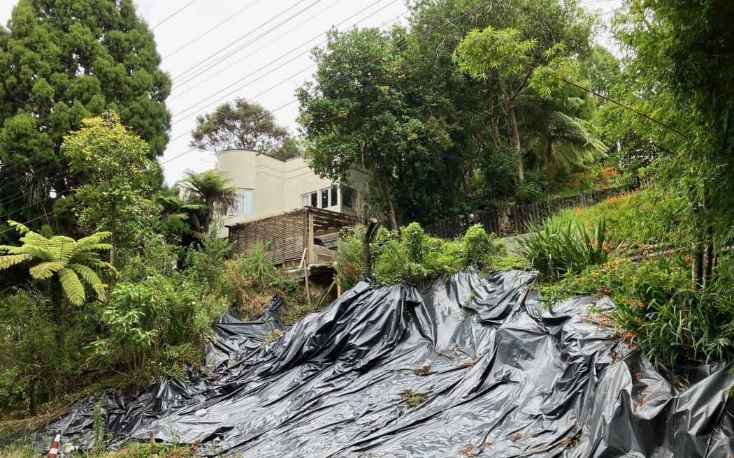 6 Mahoe rd, Titirangi, still shrouded in plastic wrap a year after the big slip